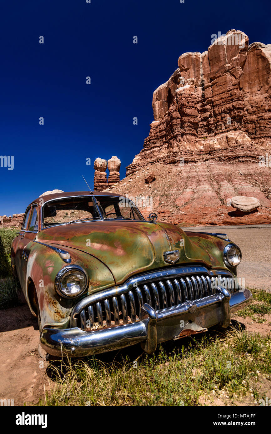 The USA, Utah, San Juan county, Bluff, classic car Buick close Navajo Twin Rocks Stock Photo