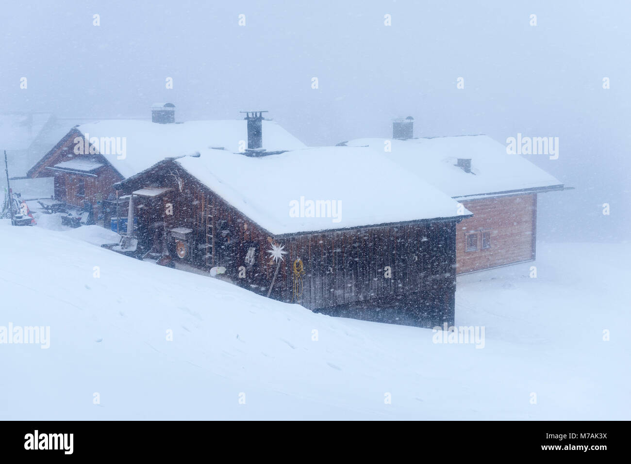 Austria, Montafon, Garfrescha alp village (1550 m), on the upper side of St. Gallenkirch. Quaint ski hut in the alp village. Stock Photo