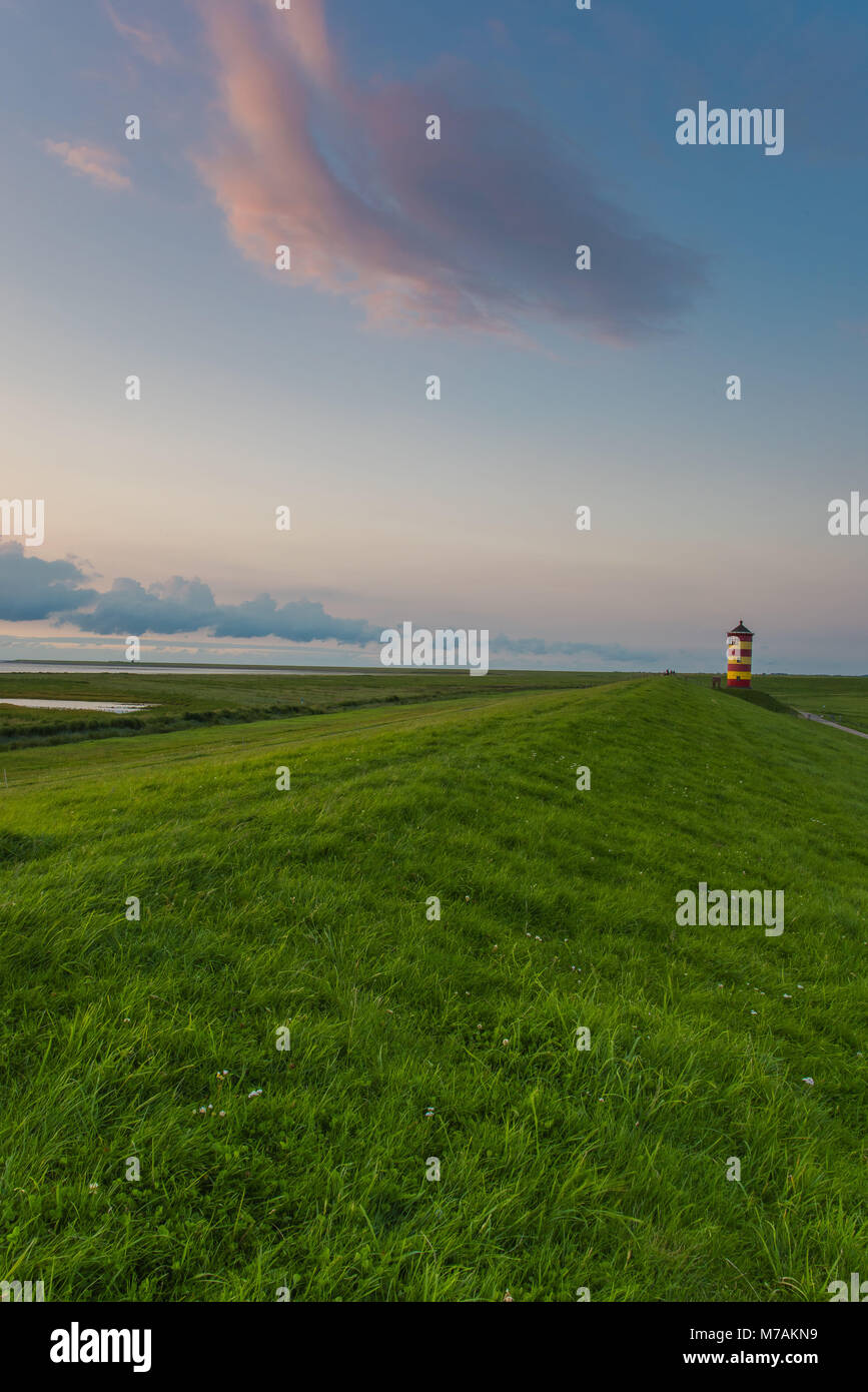 Europe, Germany, the North Sea, Lower Saxony, East Frisia, Pilsum, lighthouse of Pilsum in the evening light Stock Photo