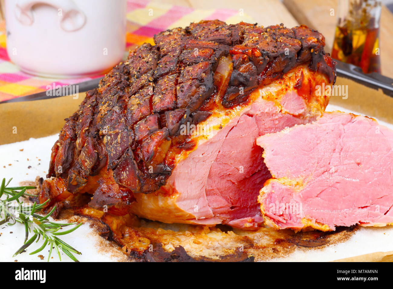 Juicy saltcrusted pork roast is cut Stock Photo Alamy