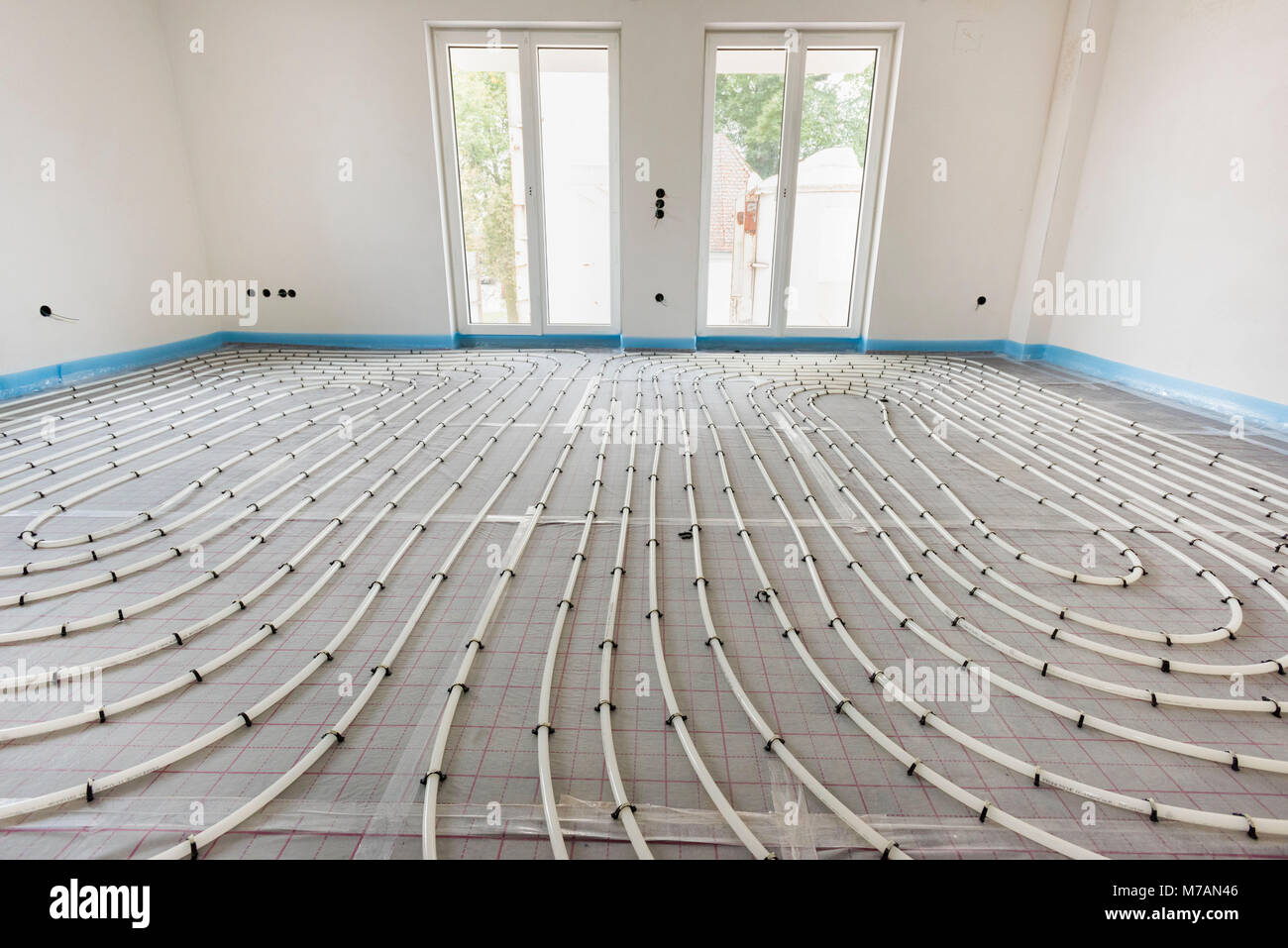 housebuilding with interior fixtures of the underfloor heating and sanitation Stock Photo