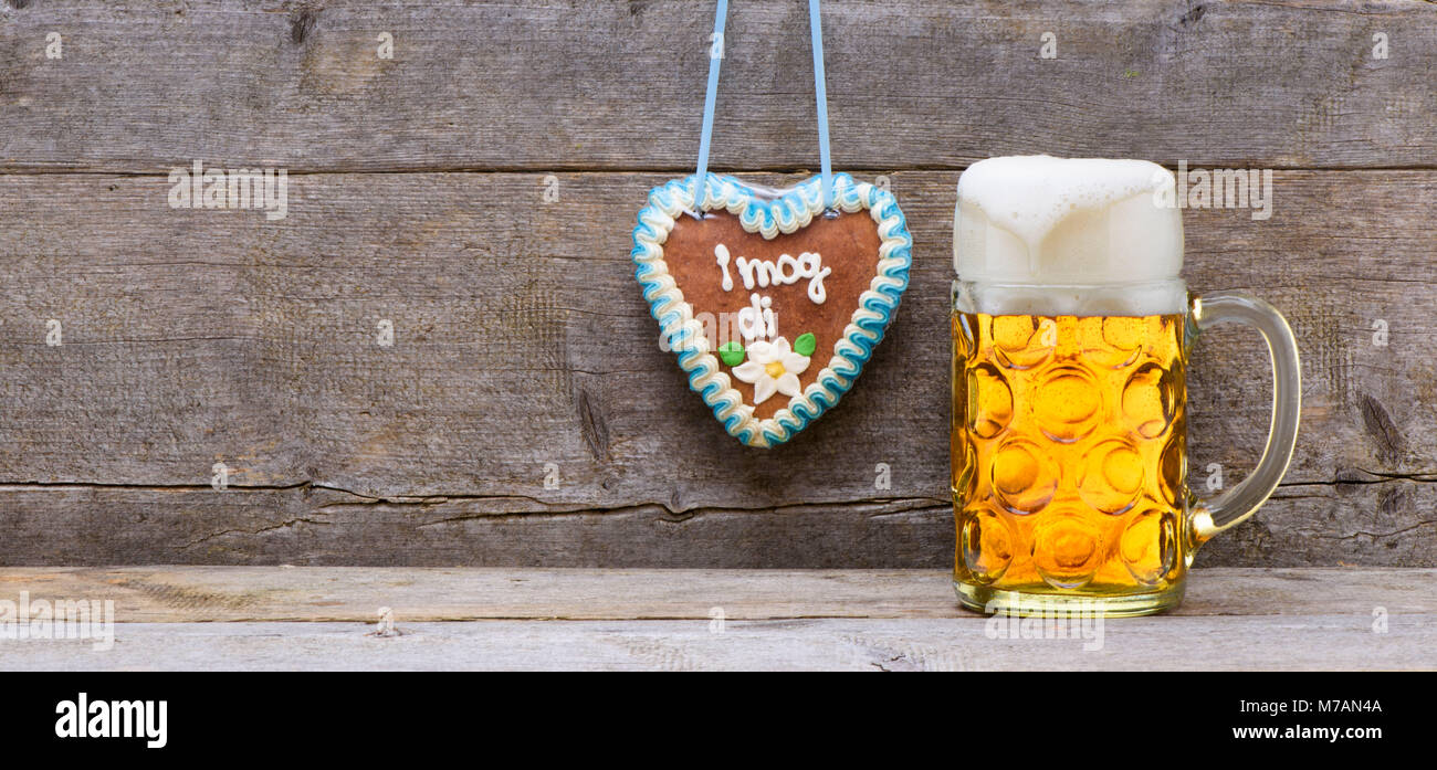 Beer mug at the Oktoberfest in Munich on wooden boards Stock Photo