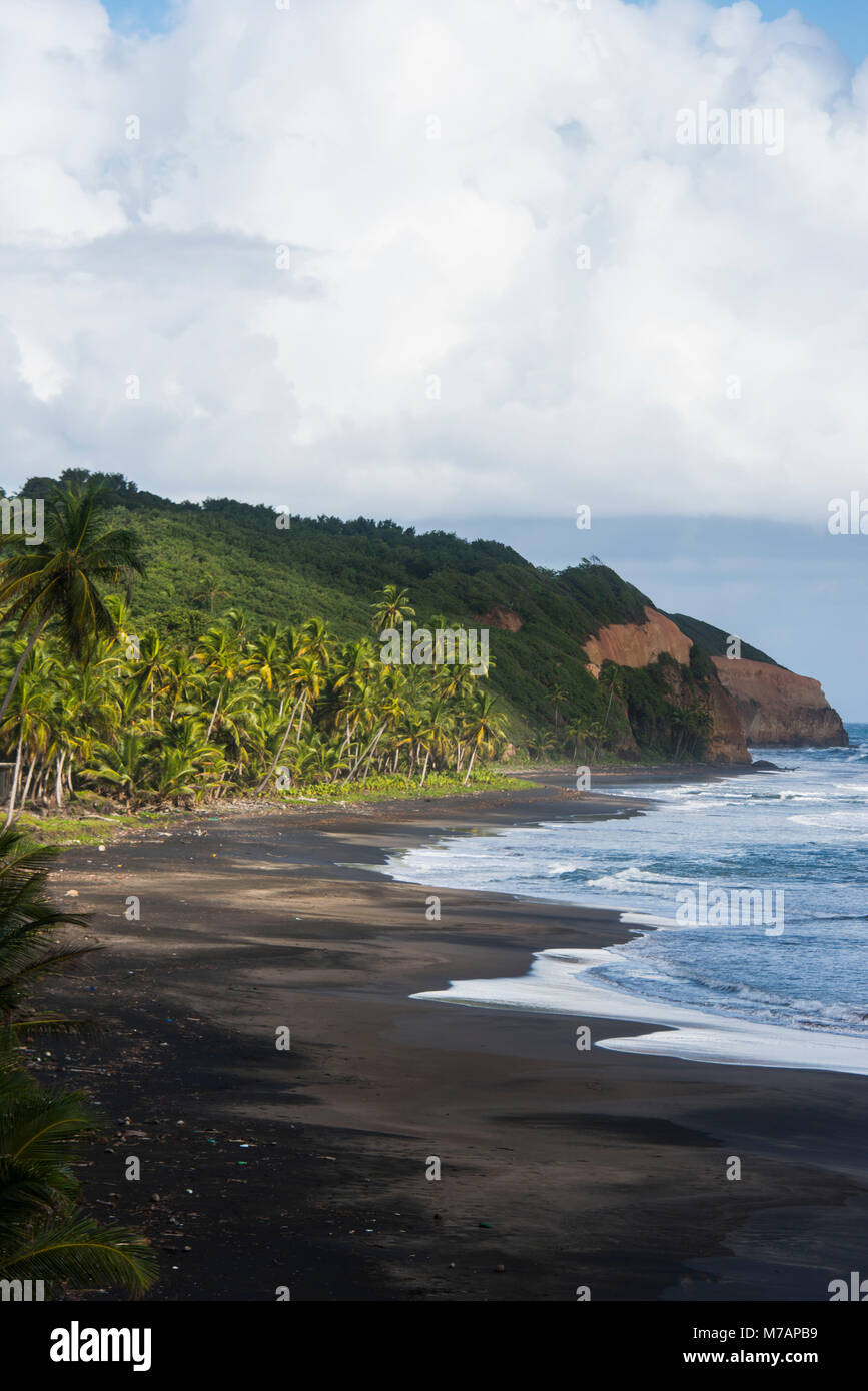 Rugged coastline with black laval sand beach Dominica Caribbean Stock Photo