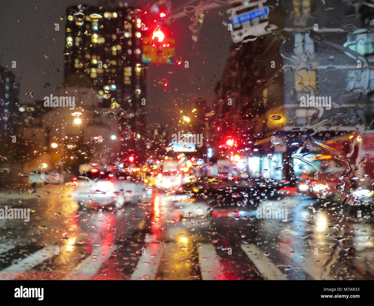 Street, traffic, car, rain drops on windshield, New York in rain Stock Photo