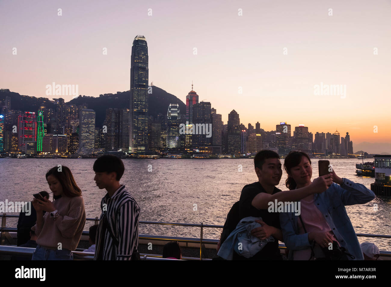 China, Hong Kong, Chinese Tourists and City Skyline Stock Photo