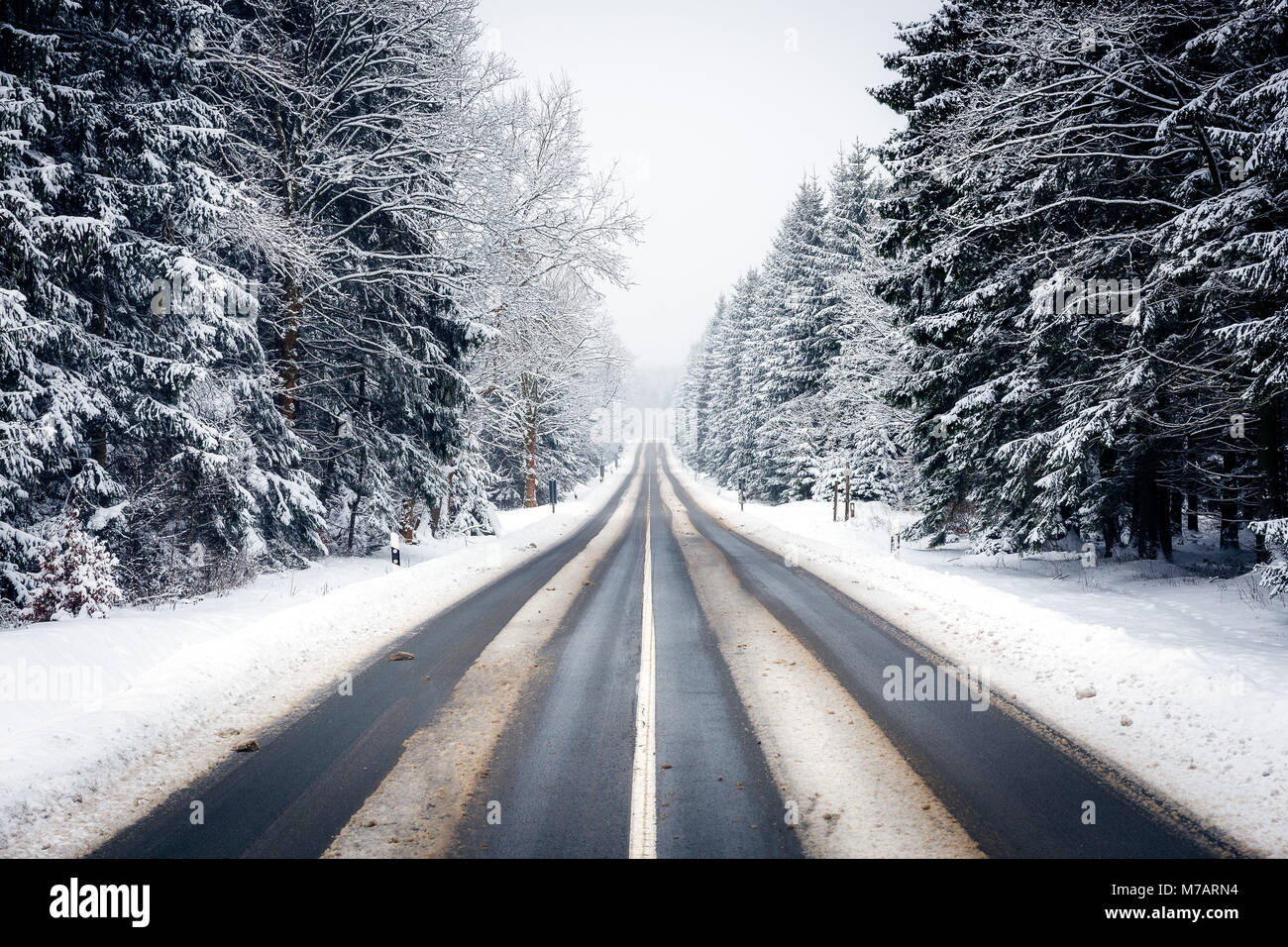 Winter road in the Harz mountains Stock Photo
