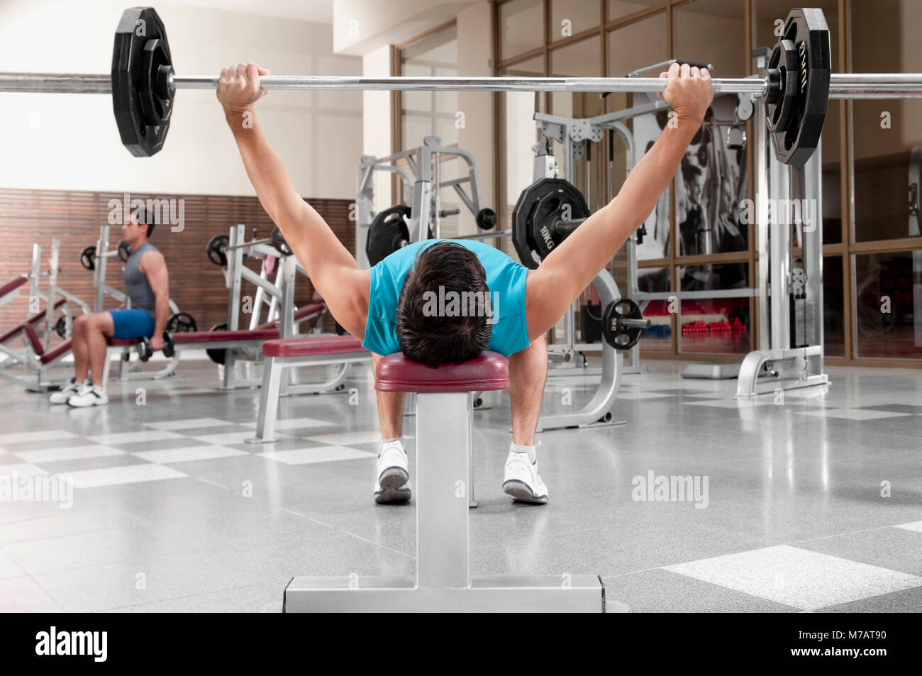 Two men exercising in a gym Stock Photo