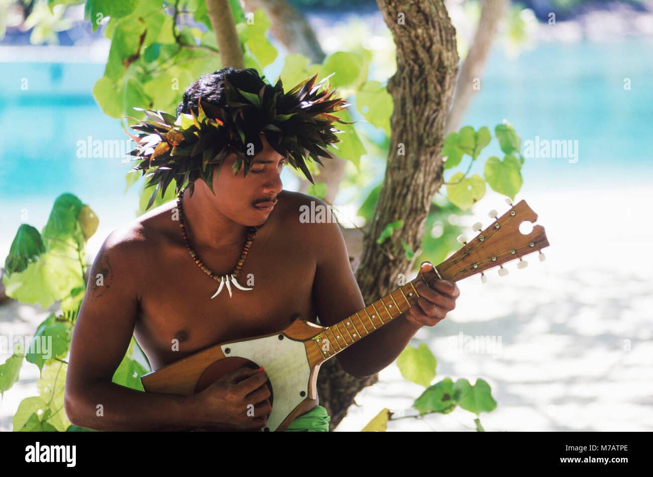 Close-up of a young man playing the ukulele, Hawaii, USA Stock Photo - Alamy