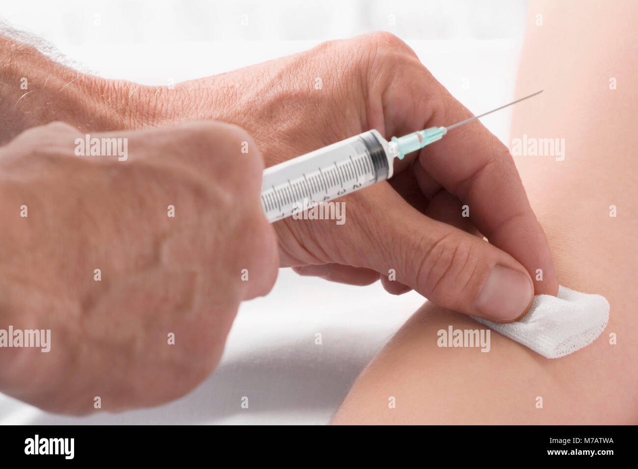 Injection Into Hand Patient getting an injection on her hand Stock Photo - Alamy