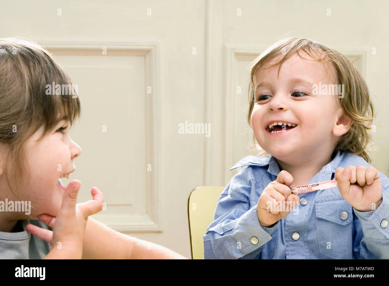 Boy and a girl looking at each other and smiling Stock Photo - Alamy