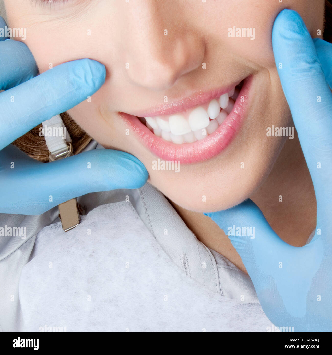 Dentist checking a woman's teeth Stock Photo Alamy