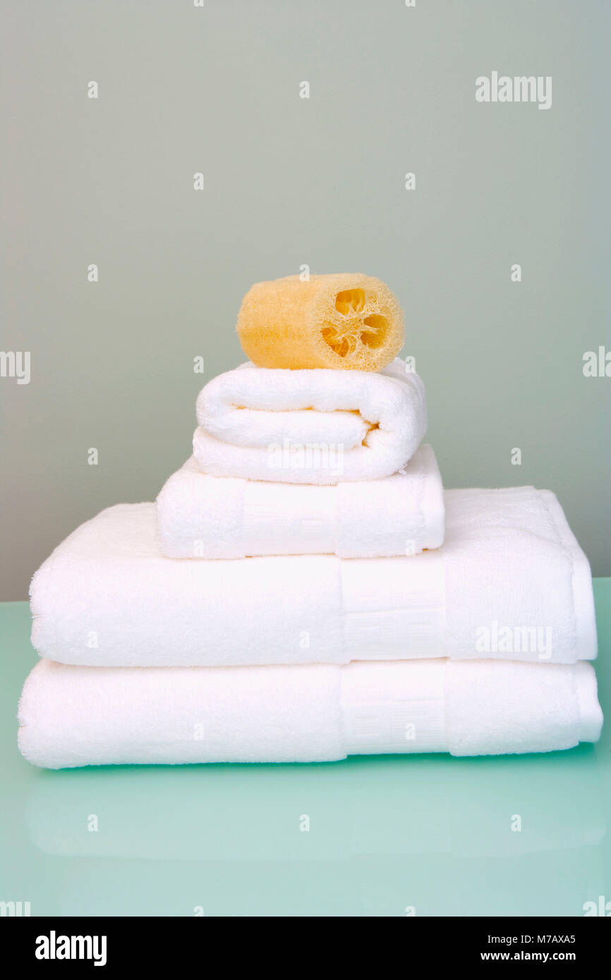 Bath sponge on towels Stock Photo Alamy