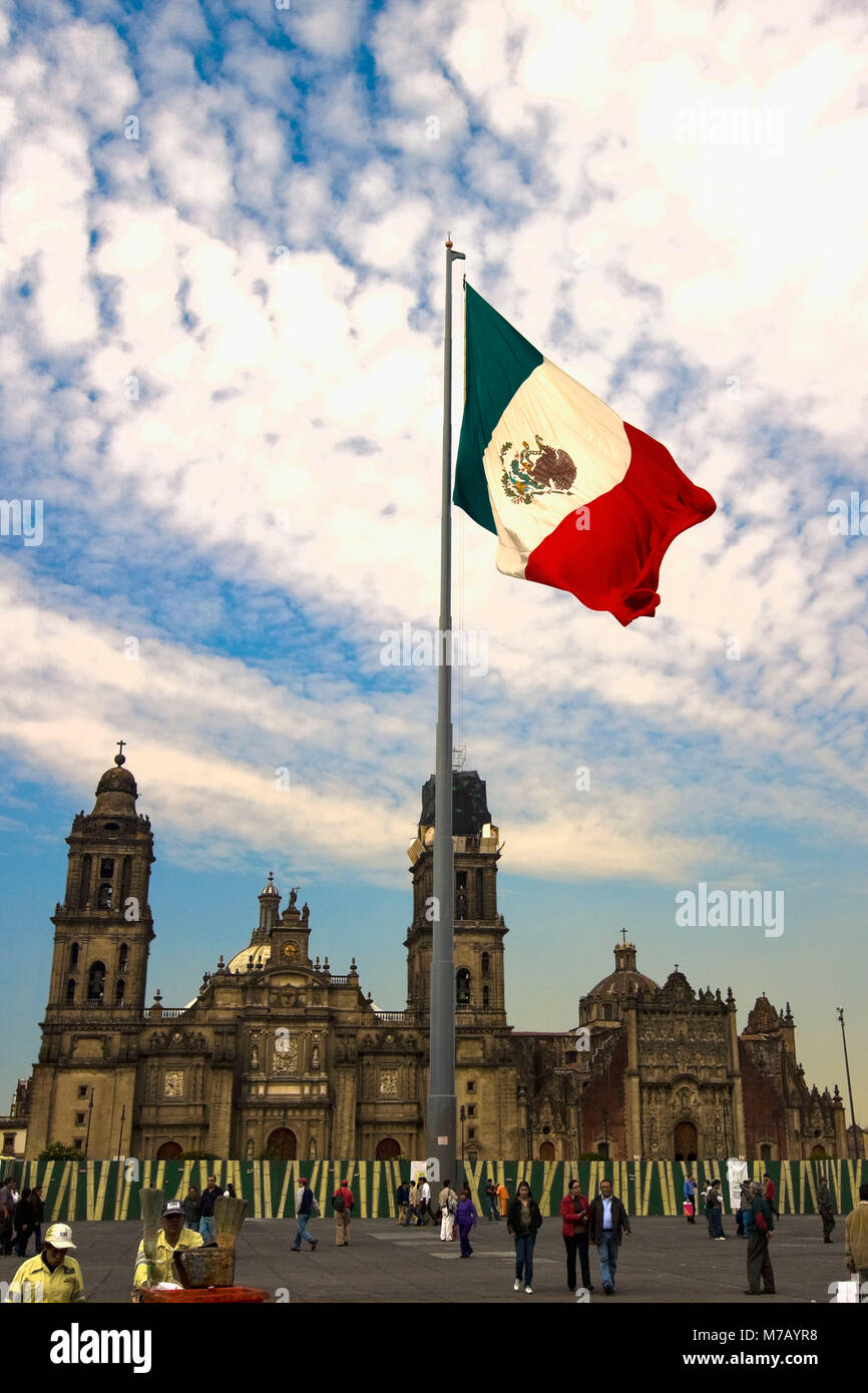 Low angle view of the Mexican flag in front of a cathedral, Metropolitan Cathedral, Zocalo, Mexico City, Mexico Stock Photo