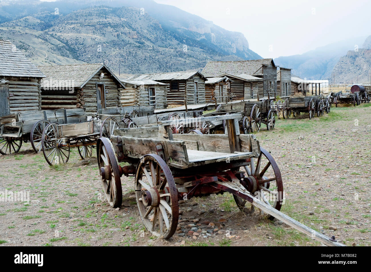 Wagons and abandoned houses in a ghost town, Old Trail Town, Cody