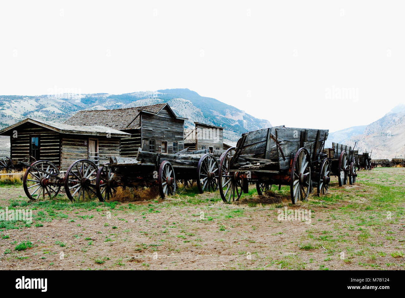 Wagons and abandoned houses in a ghost town, Old Trail Town, Cody, Wyoming, USA Stock Photo
