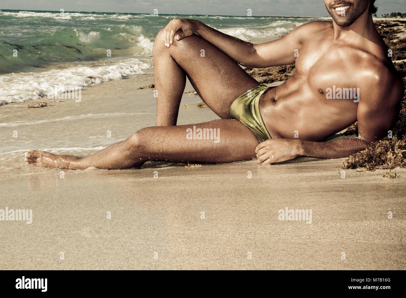 Man sunbathing on the beach, South Beach, Miami Beach, Florida, USA Stock Photo photo