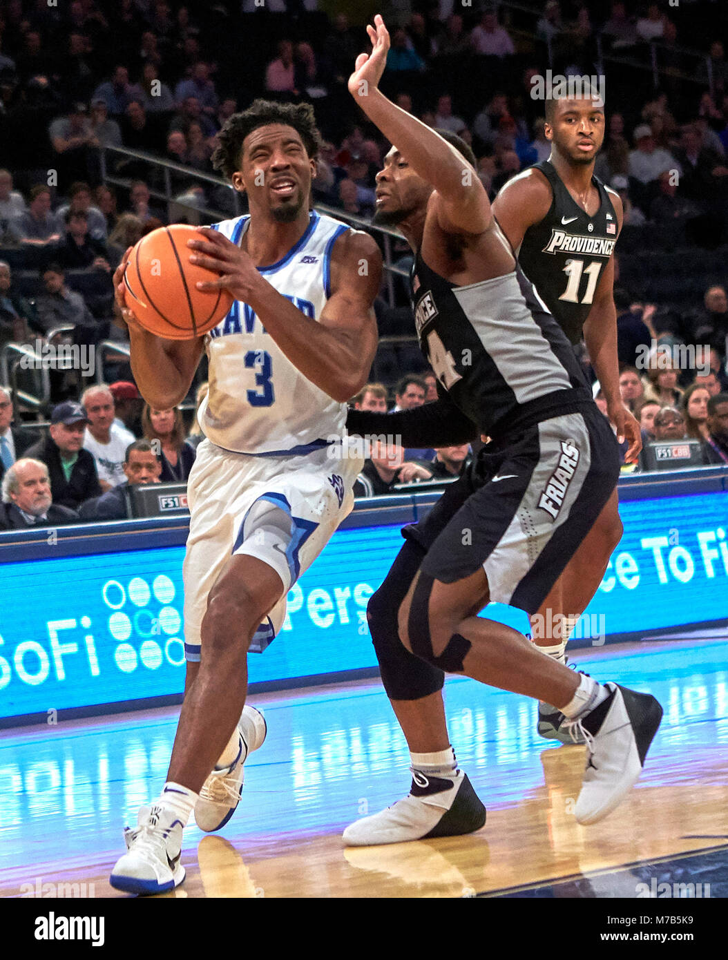 New York, New York, USA. 9th Mar, 2018. Xavier Musketeers guard Quentin Goodin (3) gets pressure from Providence Friars guard Kyron Cartwright (24) in the first half of semifinals during the Big East Conference Tournament at Madison Square Garden in New York City. Providence defeats Xavier in overtime 75-72. Duncan Williams/CSM/Alamy Live News Stock Photo