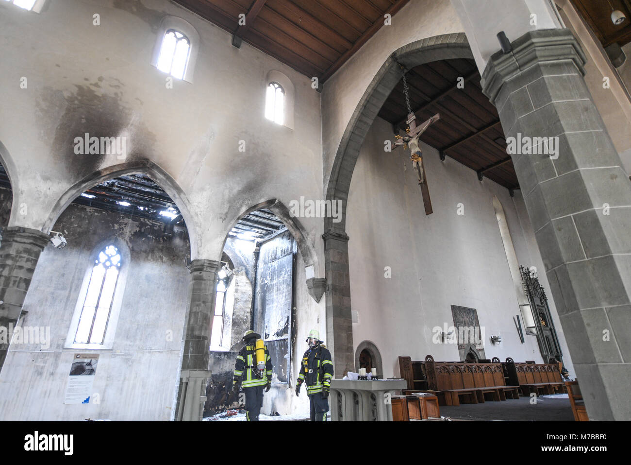 10 March 2018, Germany, Ravensburg: Firefighters inspect the damages in the church of St. Jodok after a fire. Photo: Felix Kästle/dpa Stock Photo