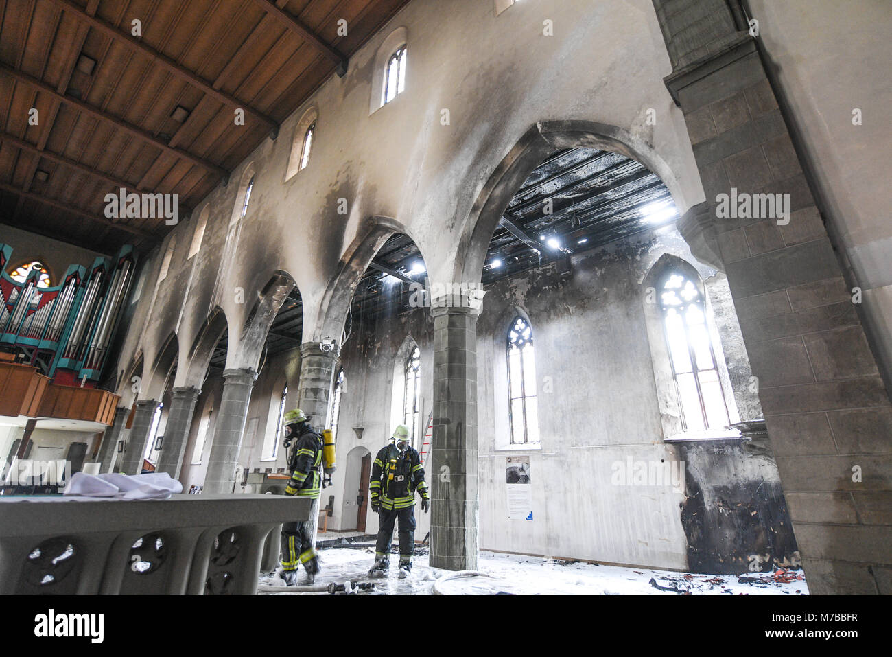 10 March 2018, Germany, Ravensburg: Firefighters inspect the damages in the church of St. Jodok after a fire. Photo: Felix Kästle/dpa Stock Photo