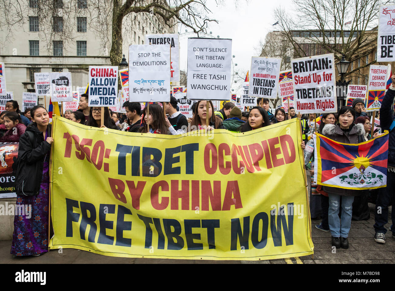 London, UK. 10th March, 2018. Members of the UK's Tibetan community attend the annual Uprising Day rally opposite Downing Street prior to a march to the Chinese embassy. Tibetan Uprising Day, observed on 10th March,  commemorates the 1959 Tibetan uprising against the presence of the People's Republic of China in Tibet. It resulted in a violent crackdown on Tibetan independence movements and the flight of the Dalai Lama into exile. Credit: Mark Kerrison/Alamy Live News Stock Photo