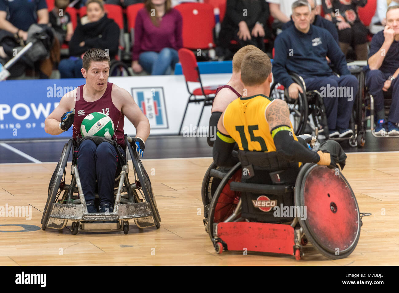 Leicester, UK, 10th March, 2018. Wheelchair Rugby Quad Nations: AUS vs GBR at Leicester Arena   Day two GBR's Jamie Stead (12) looks for a space a team Mae Jim Roberts (09) blocks Australia's Andrew Harrison (15). (c) pmgimaging /Alamy Live News Stock Photo