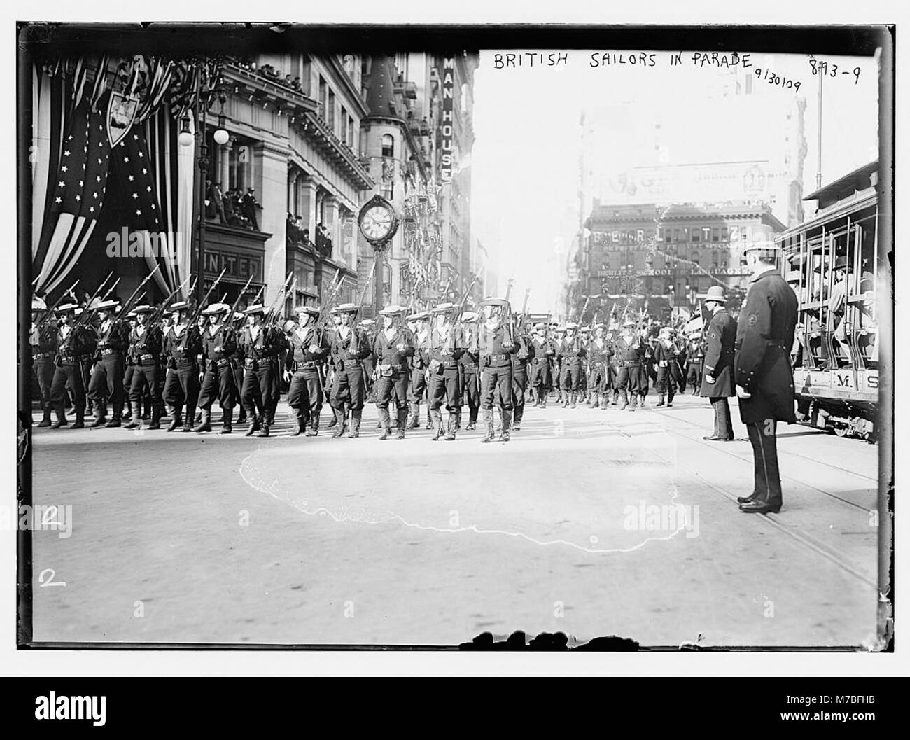 A historic photograph of British soldiers parading on a street in New York, capturing a public display of military presence in the early 20th century, likely during World War I or after. Stock Photo