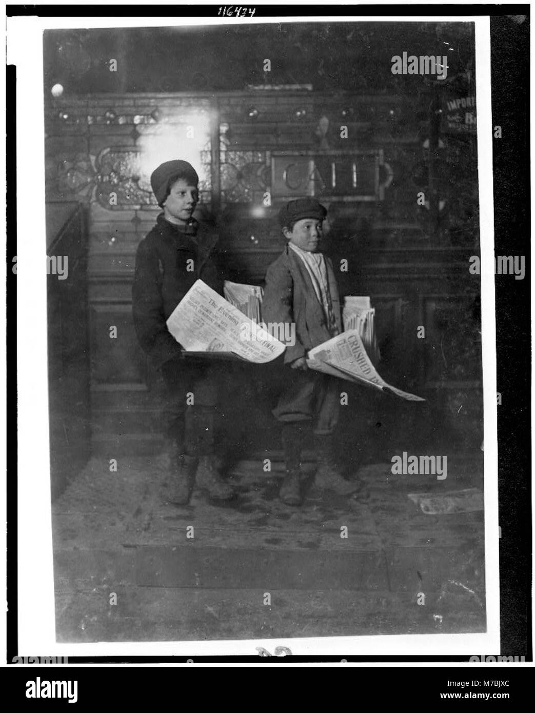 Charles Rosenhaus, 31 Monroe St. 11 years old. Morris Brond, 286 Monroe St., 9 years old. Was helping Charles. 9 P.M. Franbkfort (i.e., Frankfurt) St. near Park Row. LOC cph.3c16434 Stock Photo