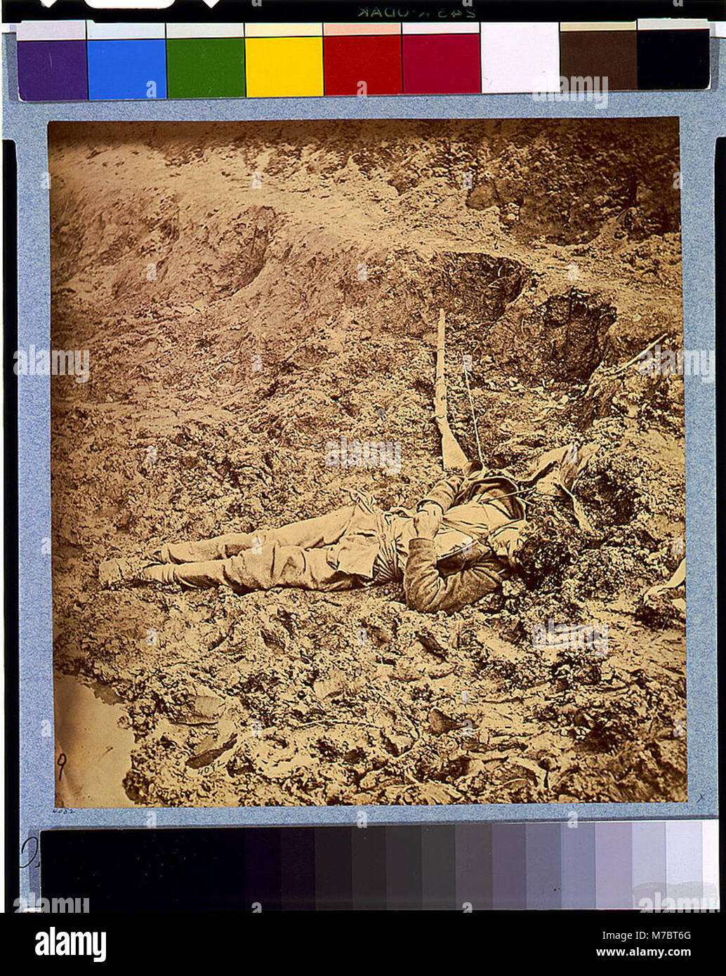 A Confederate soldier lies dead in the trenches of Fort Mahone during the Battle of Petersburg, Virginia, on April 3, 1865. This event marked a significant point in the American Civil War as Union forces advanced, leading to the eventual fall of Richmond and the surrender of General Lee. Stock Photo