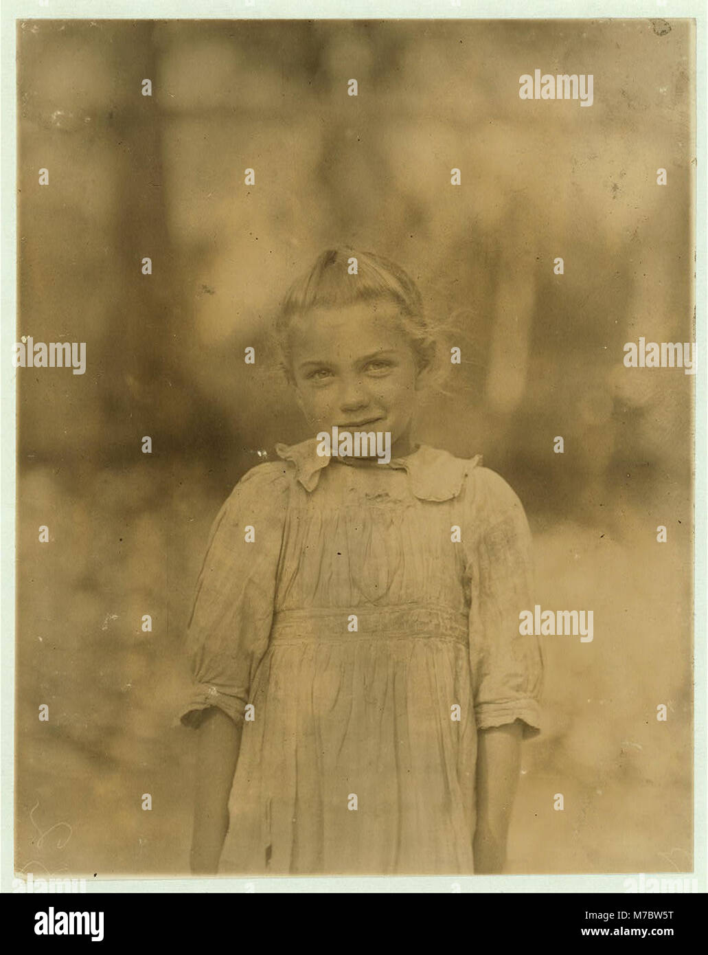 7-year old Rosie. Regular shucker. Her second year at it. Illiterate. Works all day. Shucks only a few pots a day. Varn & Platt Canning Co. LOC nclc.01012 Stock Photo