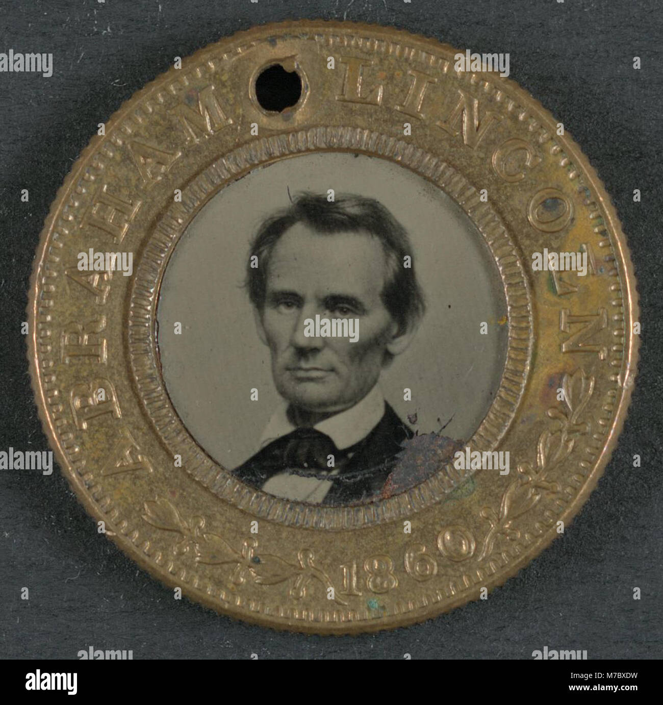 A campaign button from the 1860 U.S. presidential election, featuring Abraham Lincoln and Hannibal Hamlin as candidates for president and vice president. Stock Photo