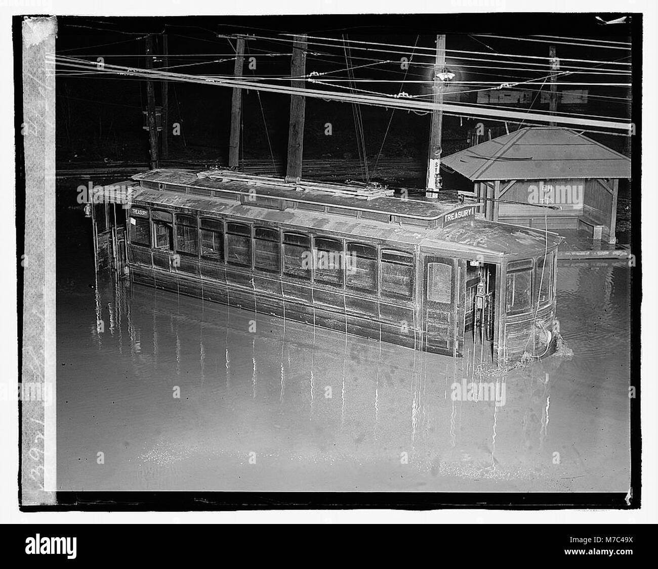 This image captures the aftermath of a flood on April 30, 1923, showcasing the destruction caused by the disaster. It reflects the impact of natural disasters on local communities and their efforts to recover. Stock Photo
