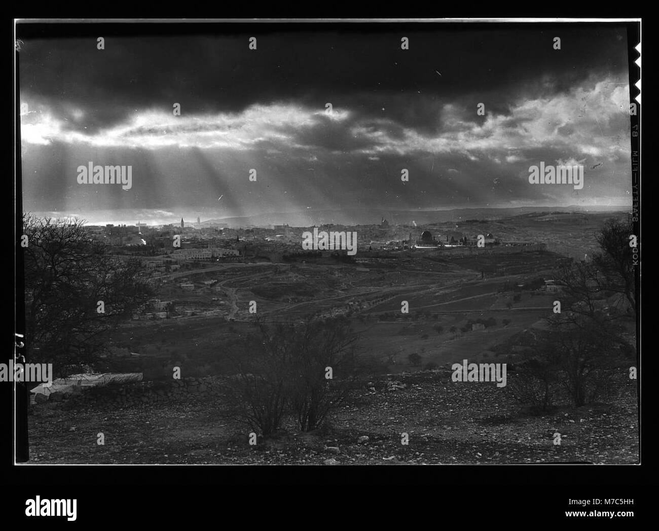 A photograph taken from Scopus showing sun rays over Jerusalem during late afternoon on February 6, 1942. This image captures the beauty and serenity of the ancient city. Stock Photo