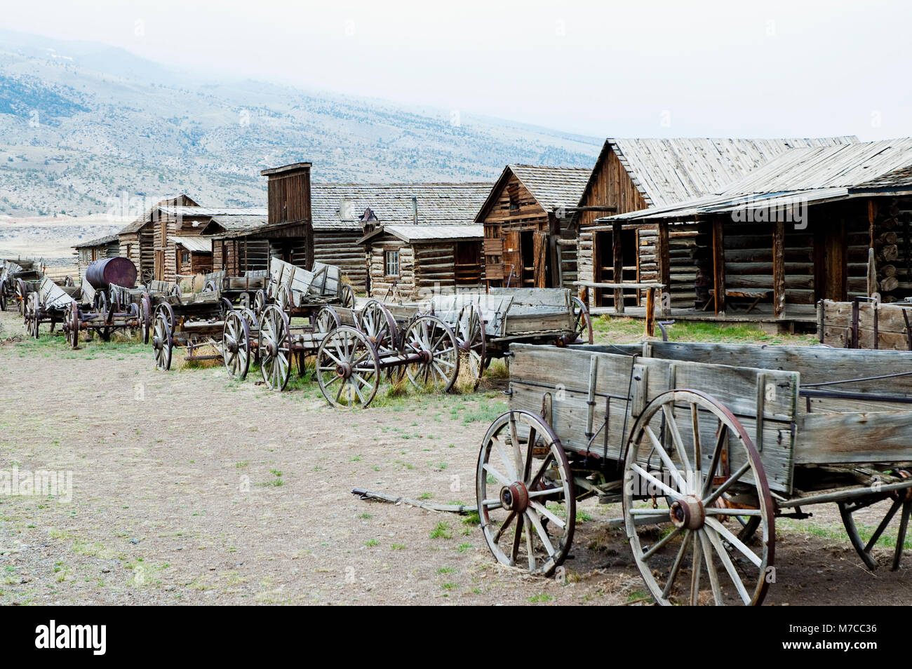 Wagons and abandoned houses in a ghost town, Old Trail Town, Cody, Wyoming, USA Stock Photo