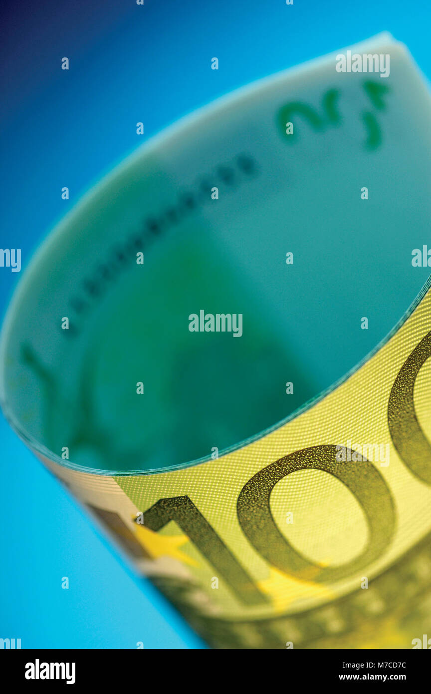 Close-up of a roll of one hundred Euro banknotes Stock Photo - Alamy