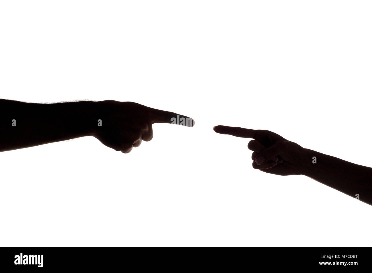 Close-up of a man's finger pointing to a woman's finger Stock Photo