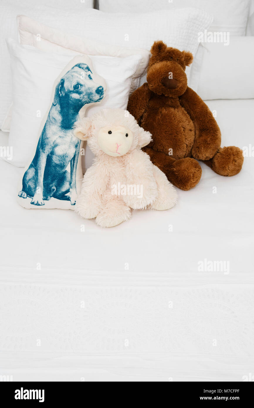 Stuffed toys on the bed Stock Photo