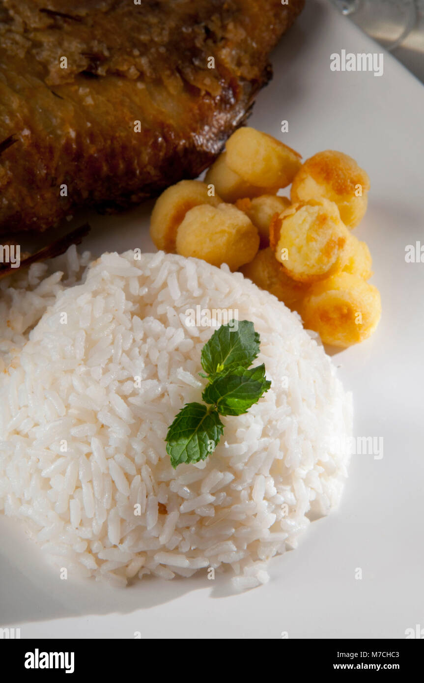High angle view of rice with fried potato puffs Stock Photo - Alamy