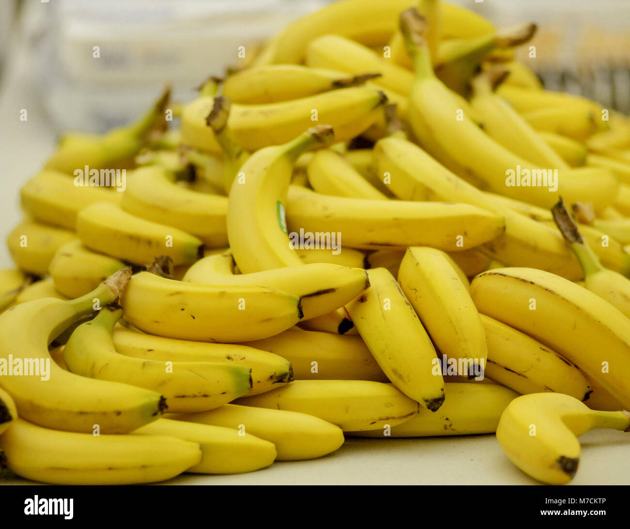 A pile of bananas on a table Stock Photo