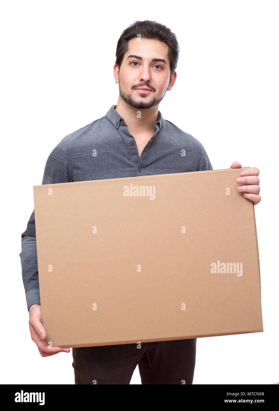 Young attractive man holding an empty board for messages, promotional. Stock Photo