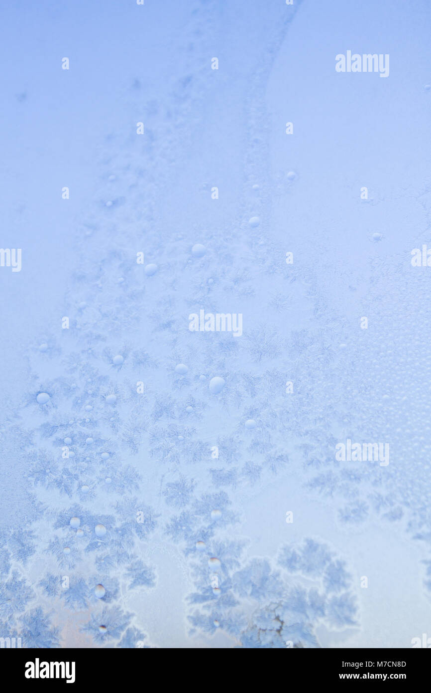 Winter frosty patterns on the frozen ice window Stock Photo - Alamy