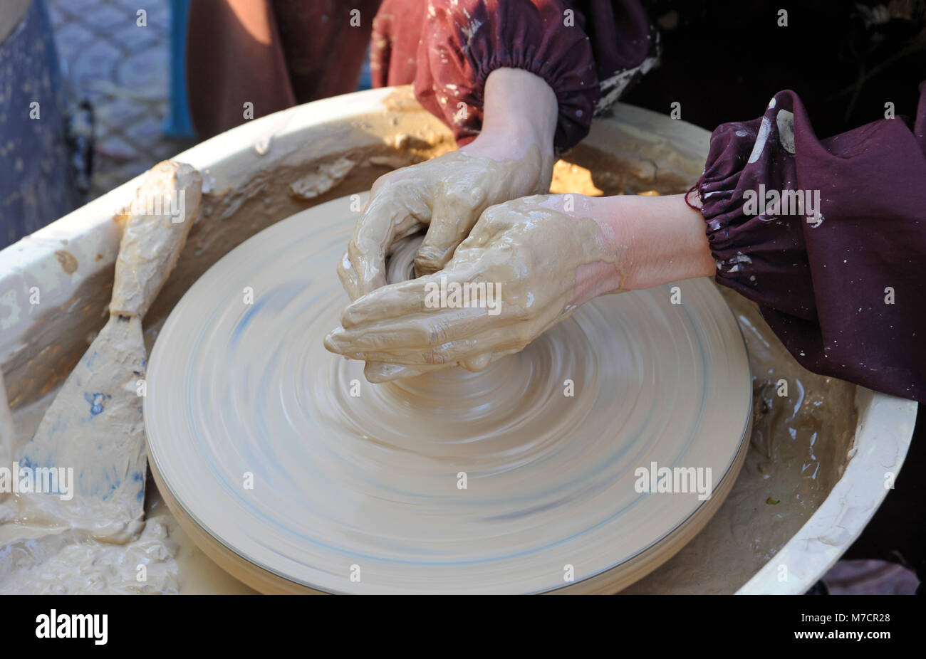Pot throwing on a potters wheel at an event in Chaoyang Park, Beijing ...