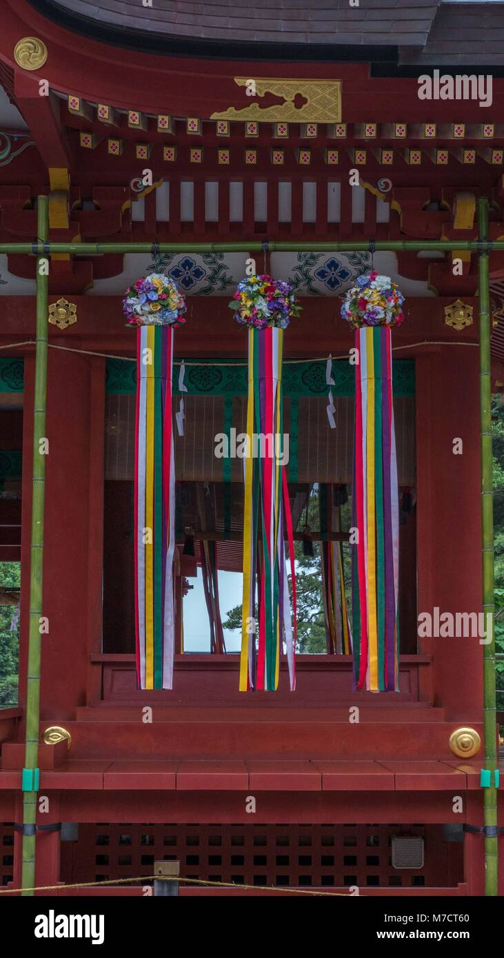 Very colorful large tanabata streamers hanging from green bamboo poles in front of Tsurugaoka Hachimangū shinto shrine in Kamakura Japan. Stock Photo