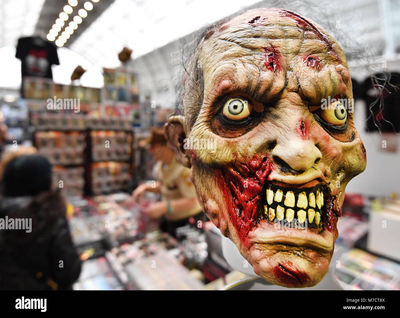A mask and other merchandise on sale at the Walking Dead convention, The Walker Stalker, at Olympia, London. Stock Photo