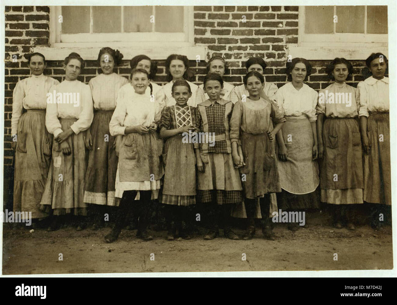 Groups of workers in Clayton (N.C.) Cotton Mills. Every one went in to work when whistle blew, and I saw most of them at work during the morning when I went through. Mr. W.H. Swift talked LOC nclc.02685 Stock Photo