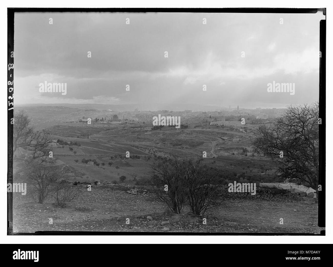 A photograph of Jerusalem taken from Scopus on February 6, 1942, showing sun rays over the city during the late afternoon. This image captures a moment of natural light over the historic city. Stock Photo