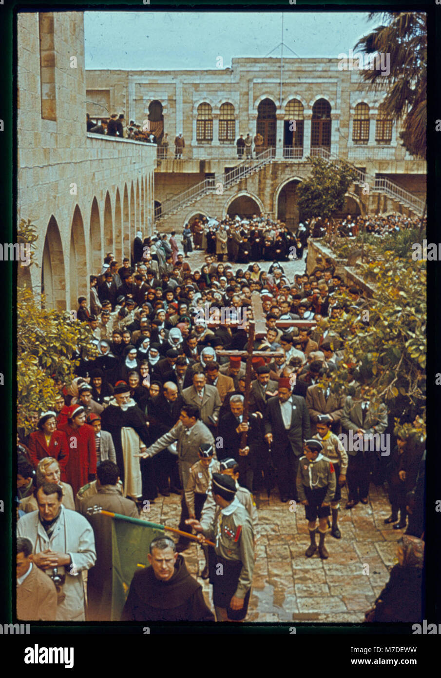 This image depicts a Good Friday procession along the Via Dolorosa in ...