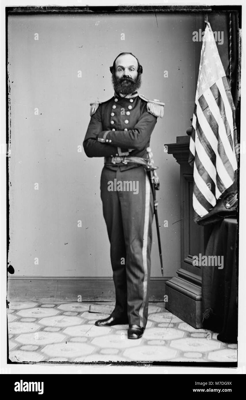 Lieutenant R.B. Riell, a U.S. Navy officer, is shown, likely reflecting ...