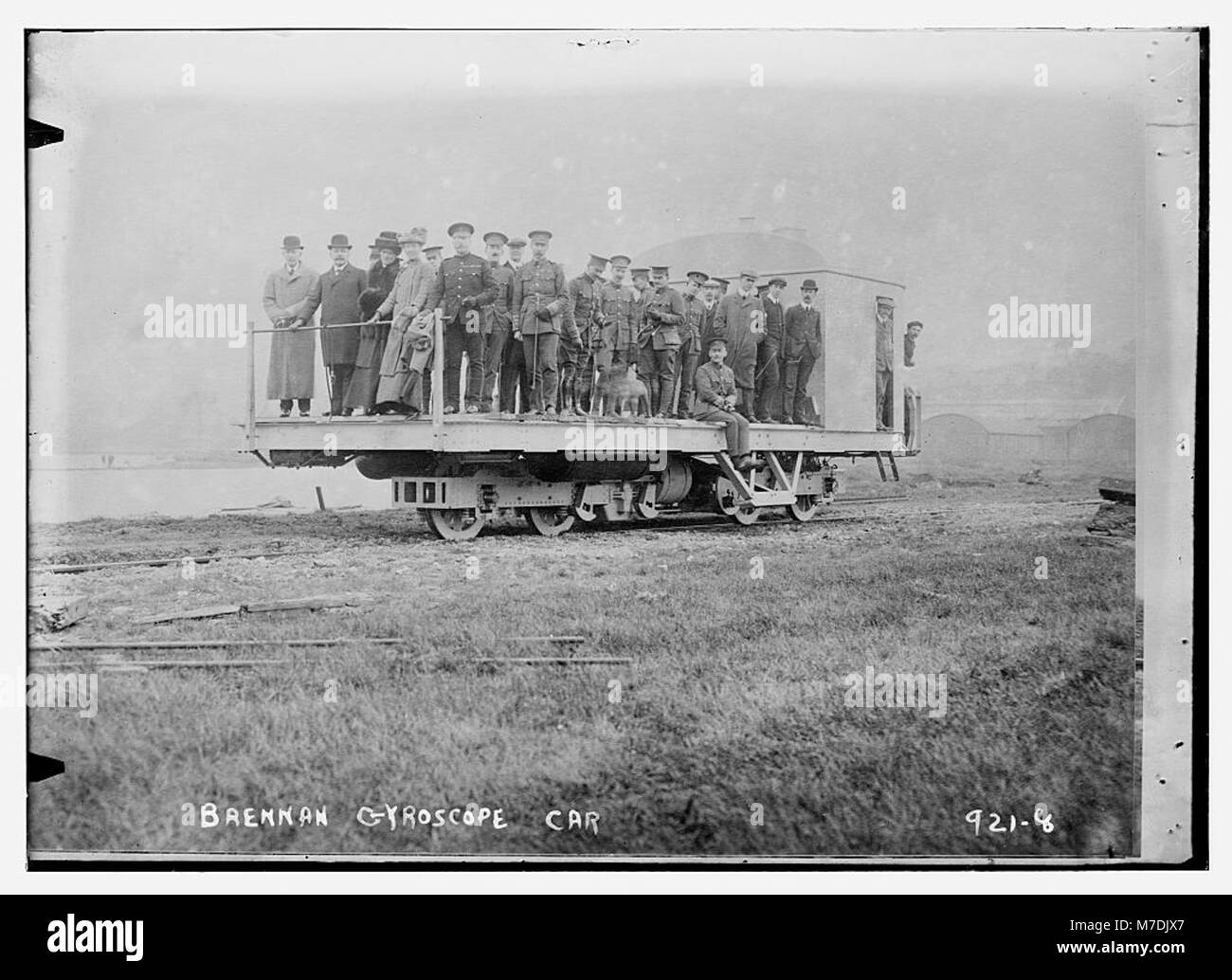 This historical photograph shows men and officers on the Brennan ...