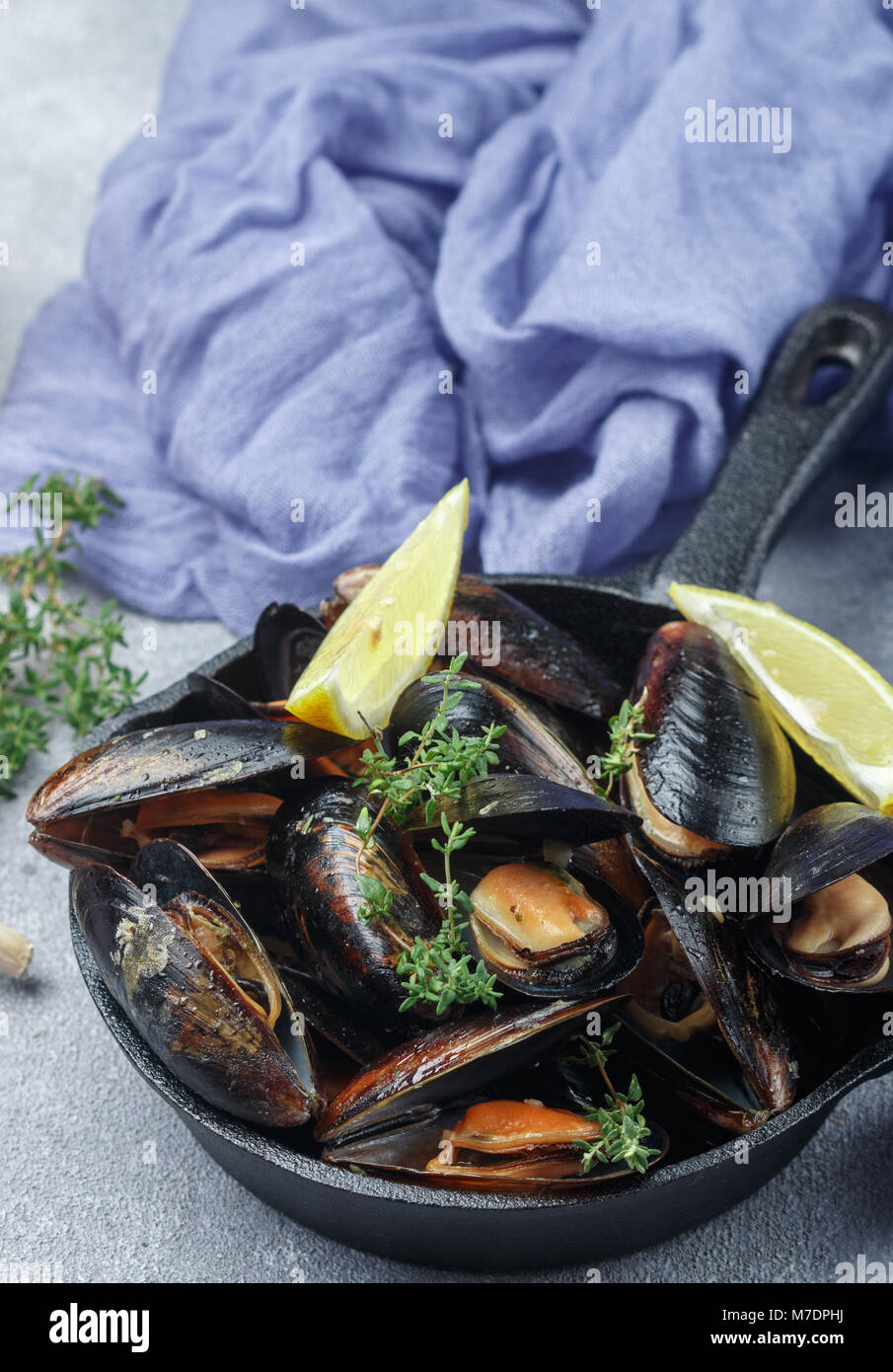Mussels in the shell with lemon, garlic and thyme. A delicious