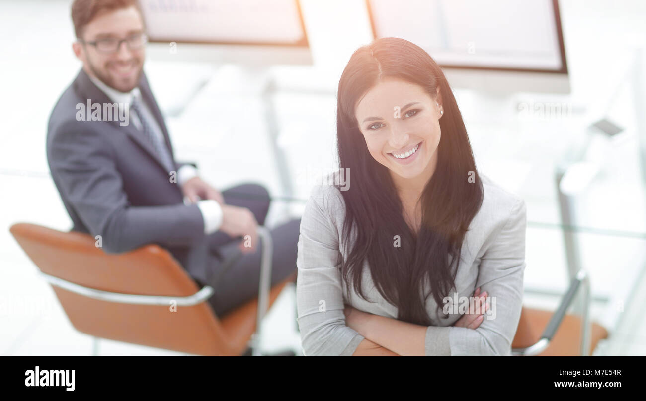 Portrait of a young business woman on a workplace background Stock ...